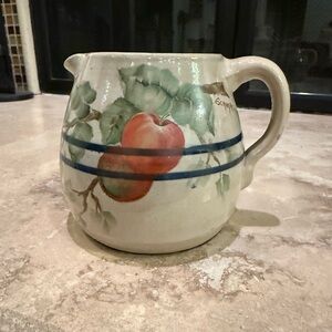 Vintage Schumacher Ceramic Pitcher with Apple Design.  Signed.  4 3/4” tall.